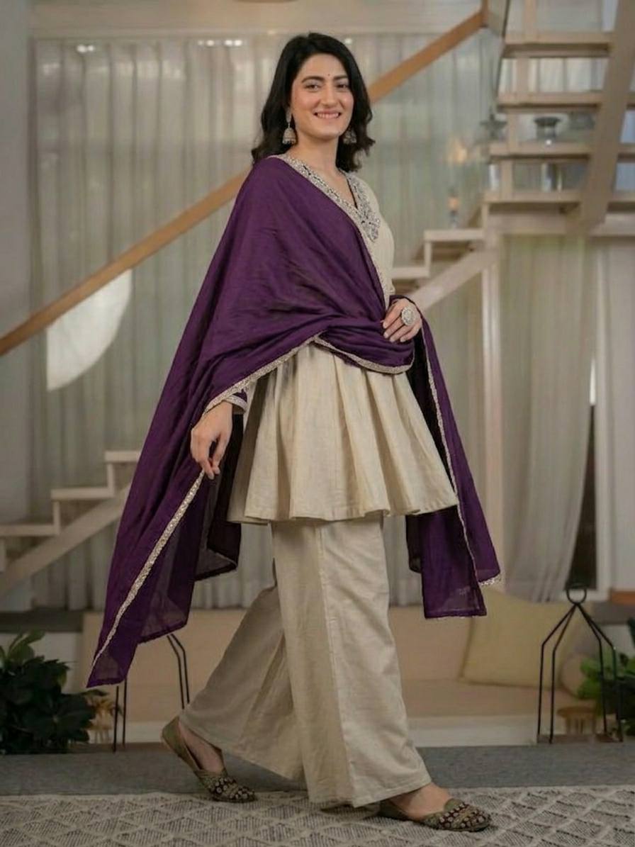 Regal Cream Silk Peplum Kurti and Flared Palazzo Suit Set Adorned with Ornate V-Neck Embroidery and a Rich Plum Purple Dupatta